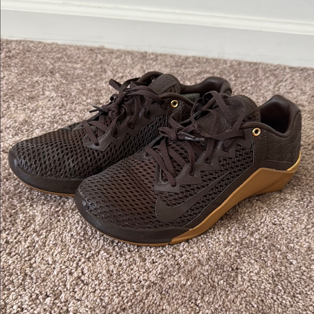 Nike Dark Brown Athletic Shoes with Gold Accents